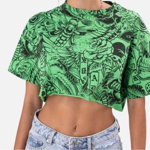 Adika; Old-school cropped tee in green with designs.